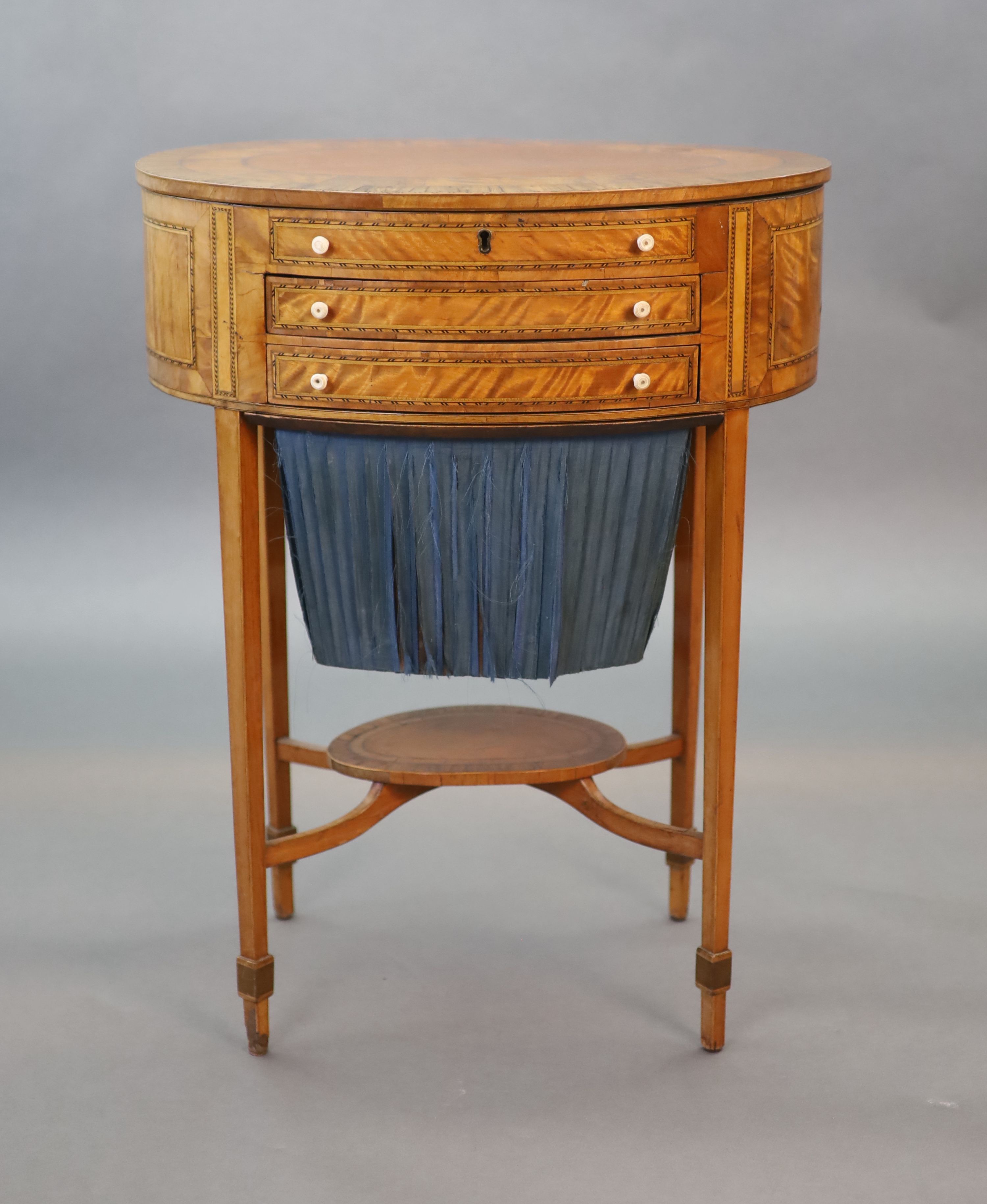 A George III rosewood banded satinwood oval work table, W.54.5cm D.39cm H.70cm
